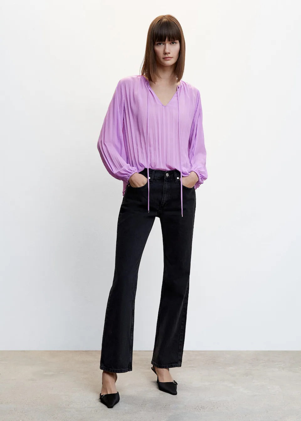 Pleated blouse with puffed sleeves