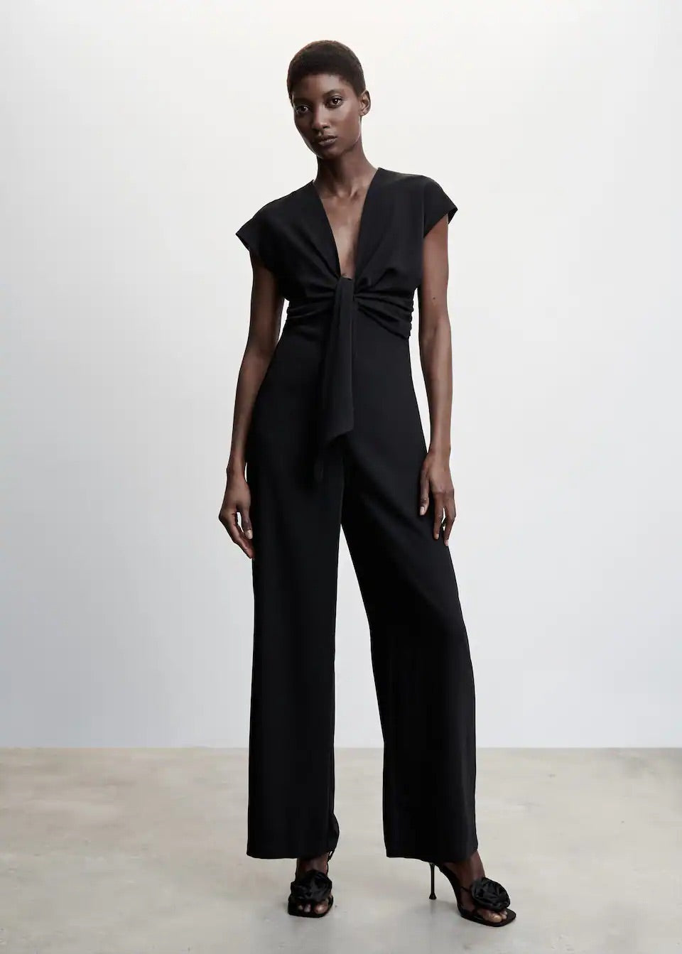 Short-sleeved jumpsuit with knot detail