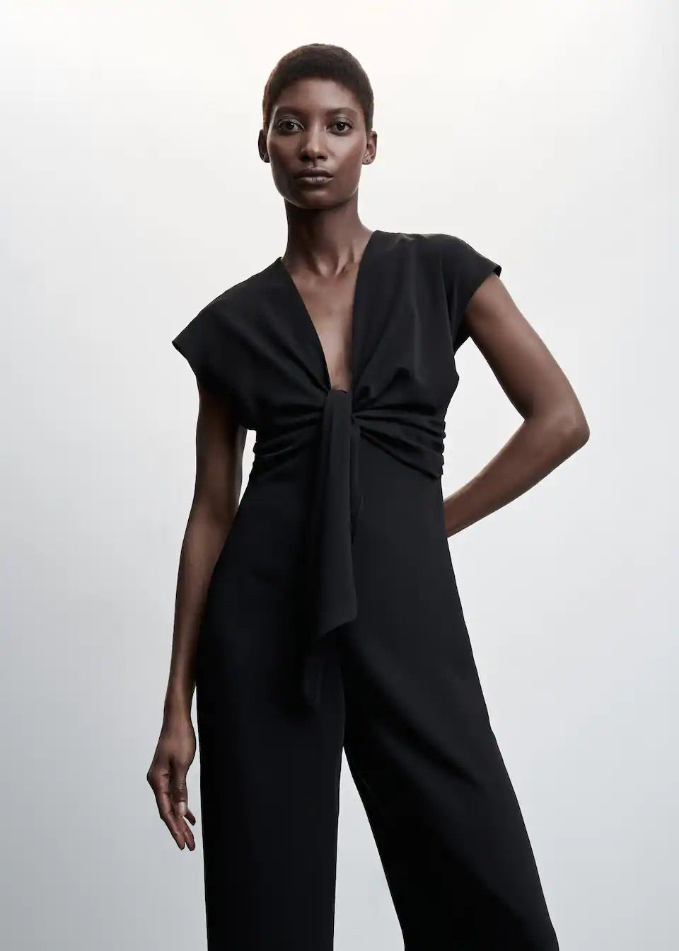 Short-sleeved jumpsuit with knot detail