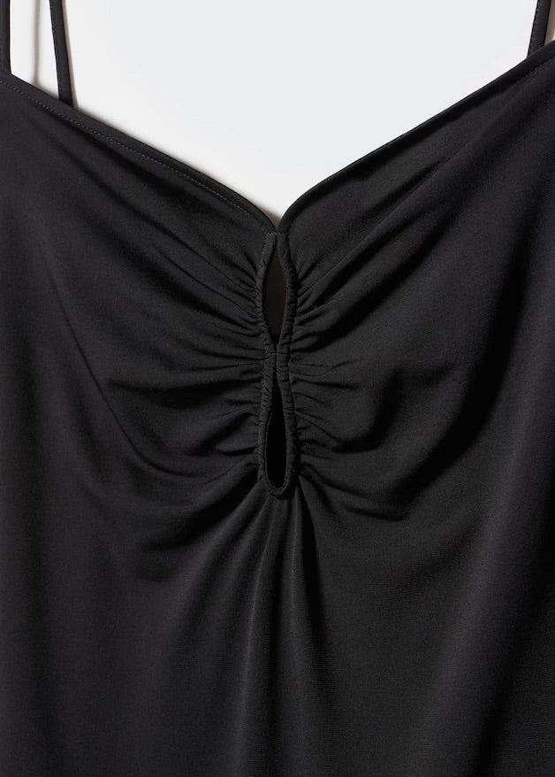 Dress with pleated details and opening