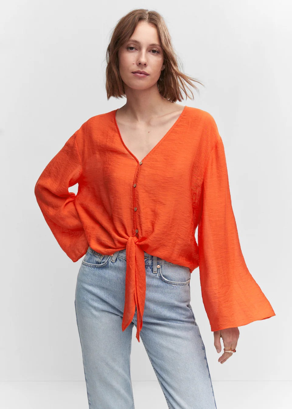 Flared-sleeve blouse with bow