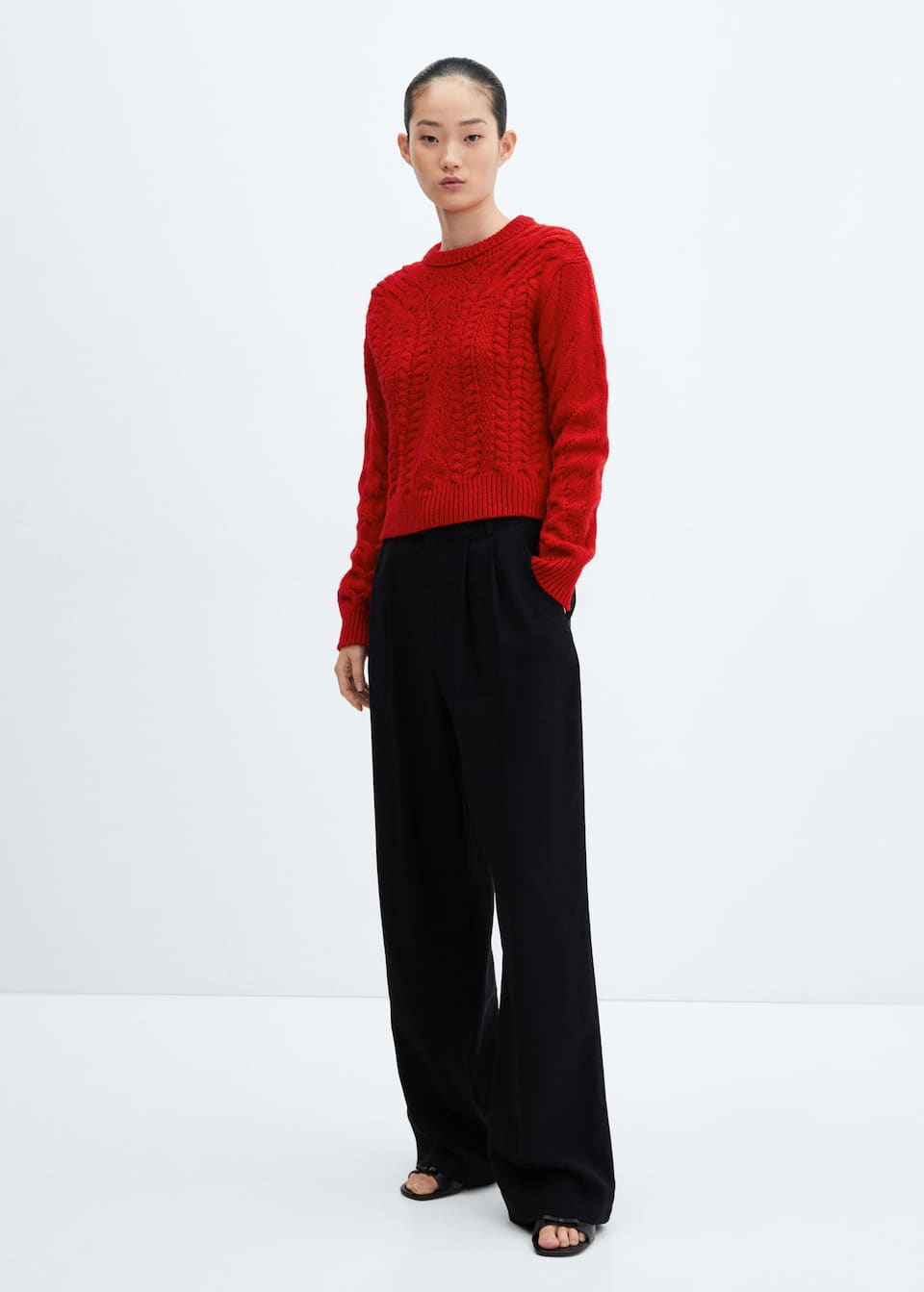 Knitted sweater with openwork details