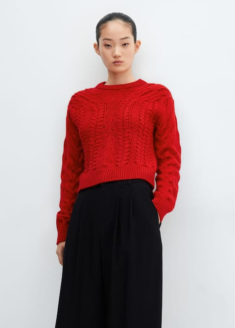 Knitted sweater with openwork details