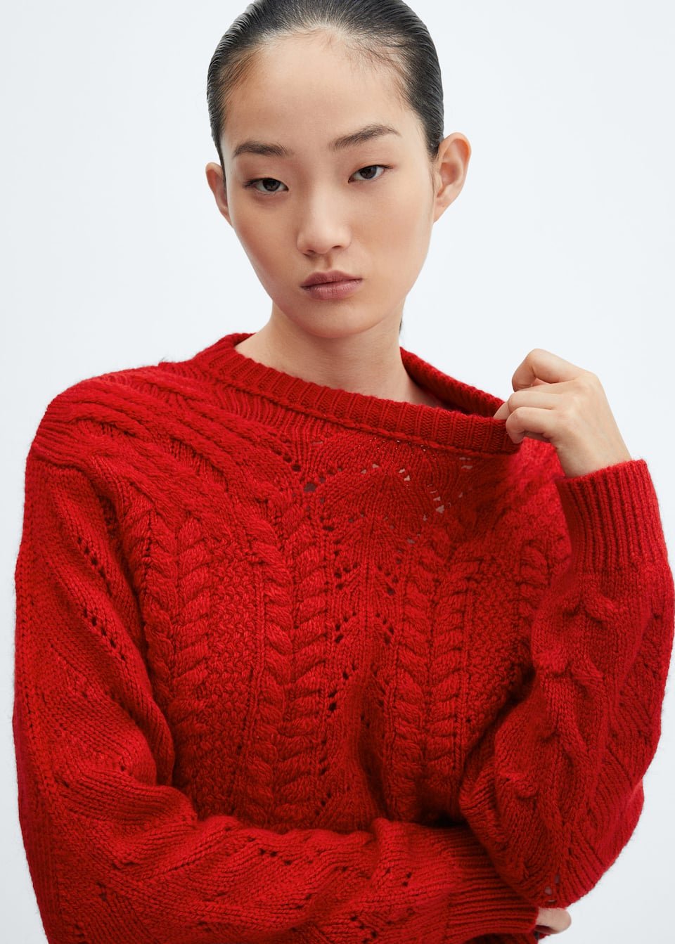 Knitted sweater with openwork details