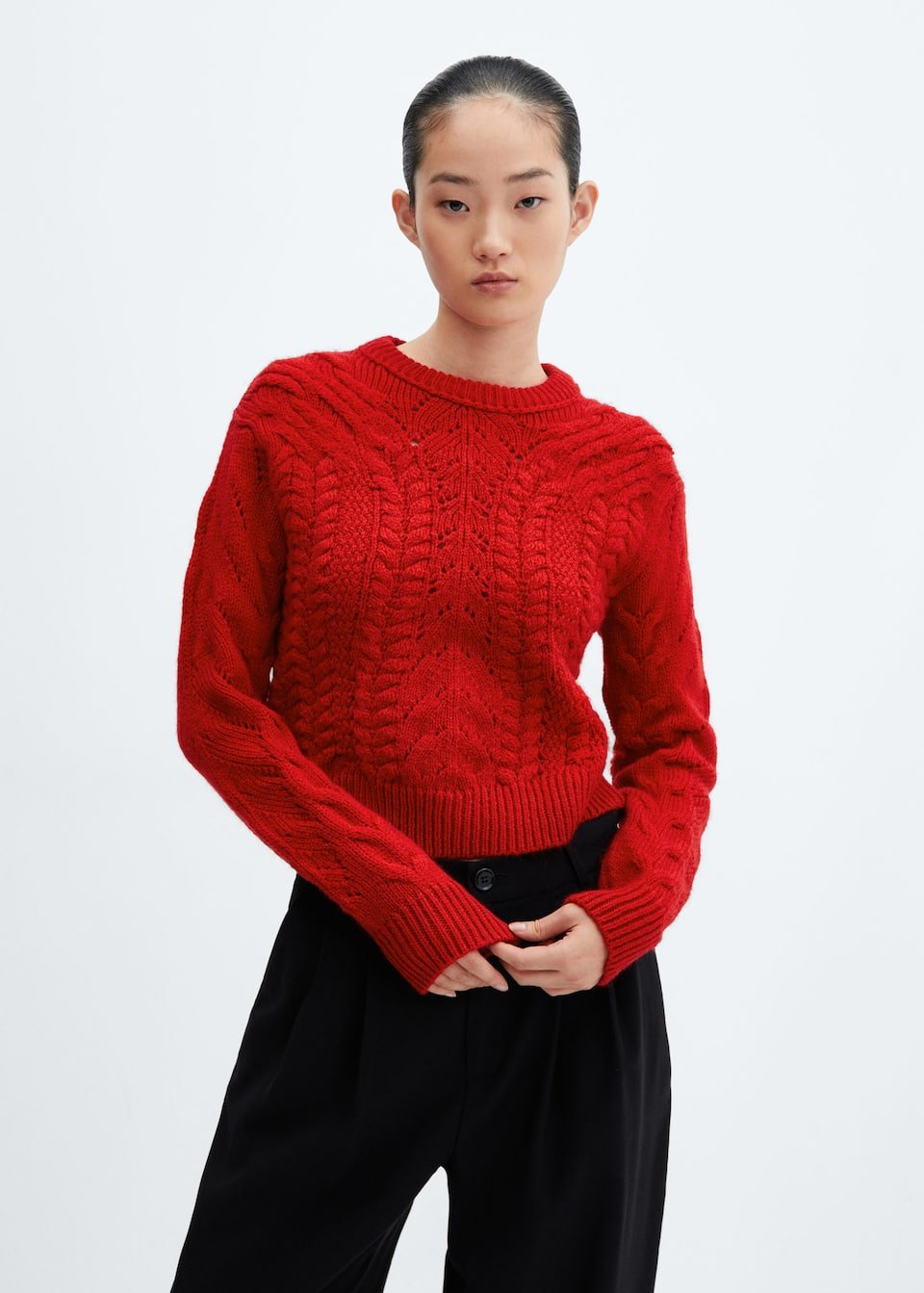 Knitted sweater with openwork details