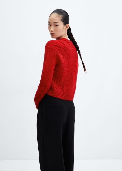 Knitted sweater with openwork details