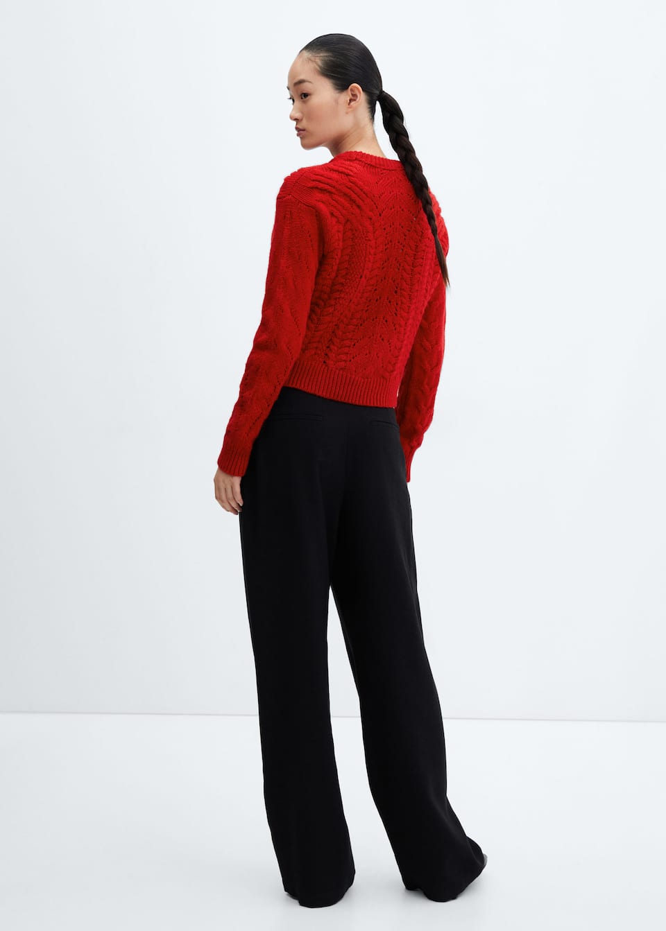 Knitted sweater with openwork details